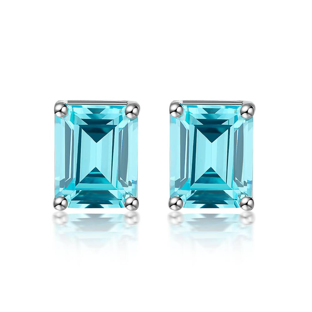 Light-blue stud earrings in emerald cut