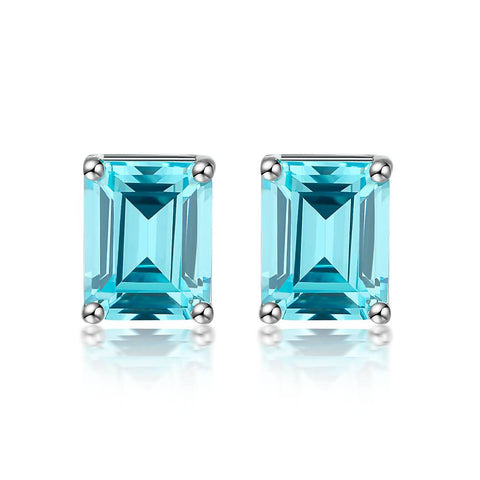 Light-blue stud earrings in emerald cut