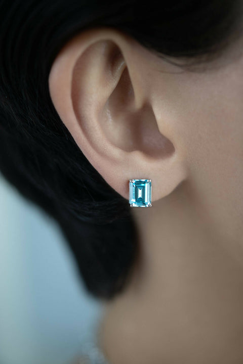 Blue stud earrings in emerald cut