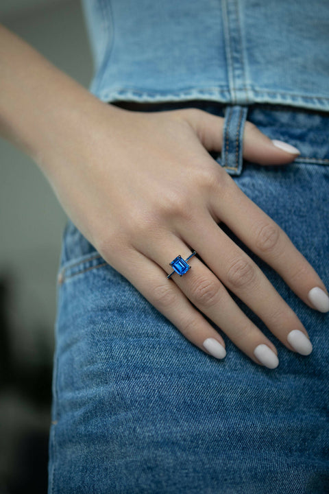 Ring with a dark-blue stone