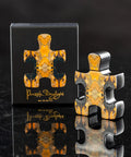 puzzle-daylight-perfume-bottle-box-reflection-on-black-surface