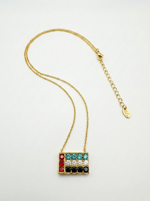 Necklace with colorful UAE Flag pendant on a white background