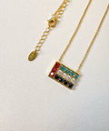 Necklace with colorful UAE Flag pendant on a white background