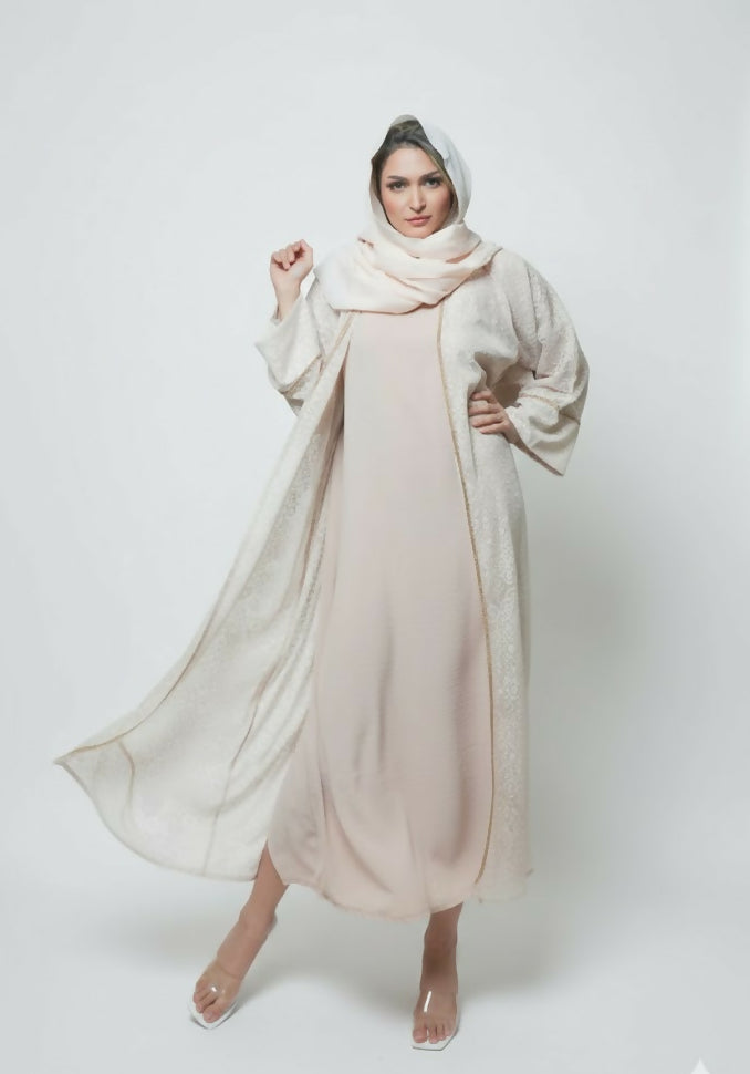 Modern women’s abaya consisting of three pieces decorated with lace with scarf