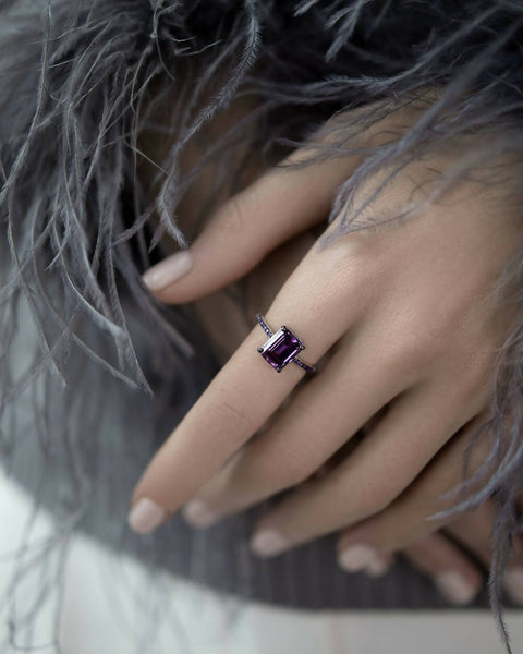 Ring with a purple stone