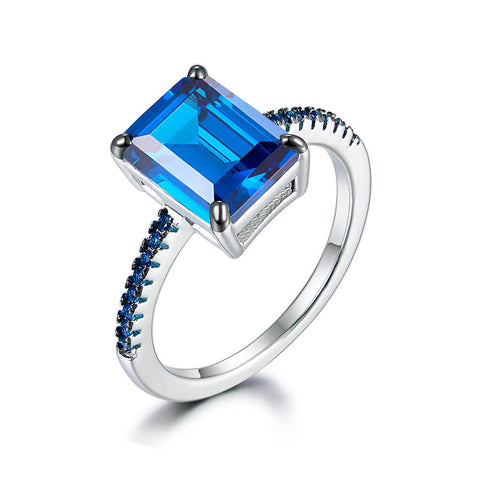 Ring with a dark-blue stone