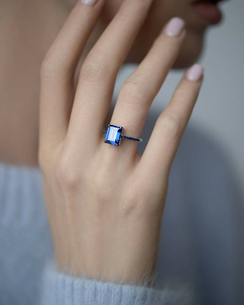 Ring with a dark-blue stone