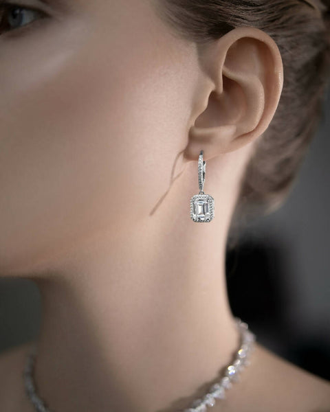 Emerald cut earrings with white stone