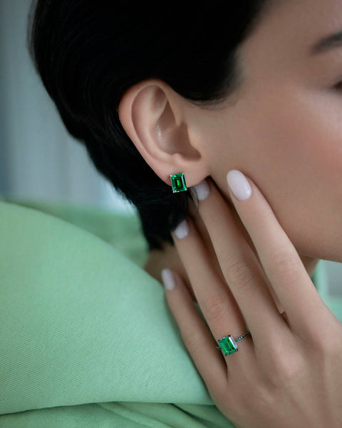 Green stud earrings in emerald cut