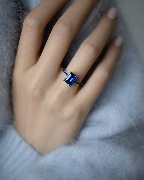 Ring with a dark-blue stone