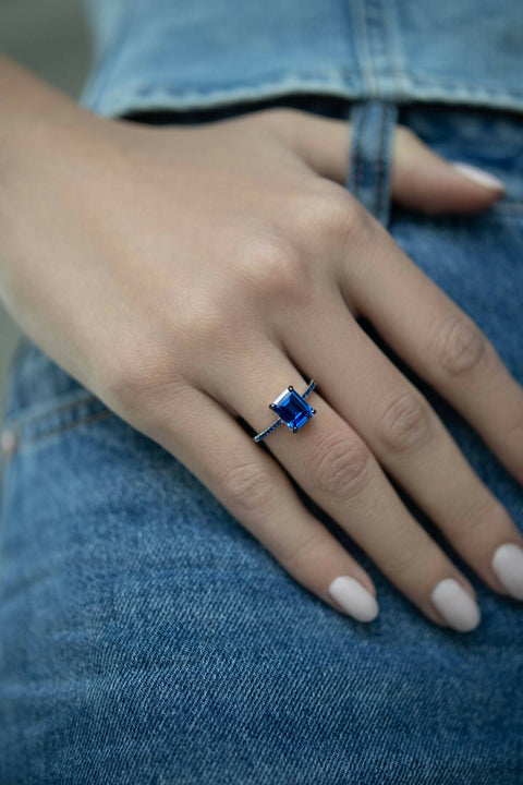 Ring with a dark-blue stone