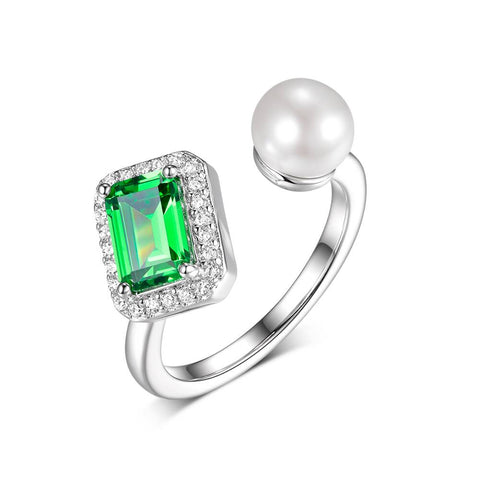 Ring with emerald-cut stone and a pearl