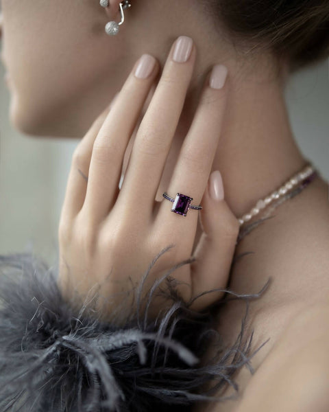 Ring with a purple stone