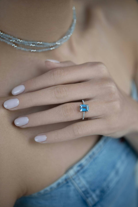 Ring with a light-blue stone