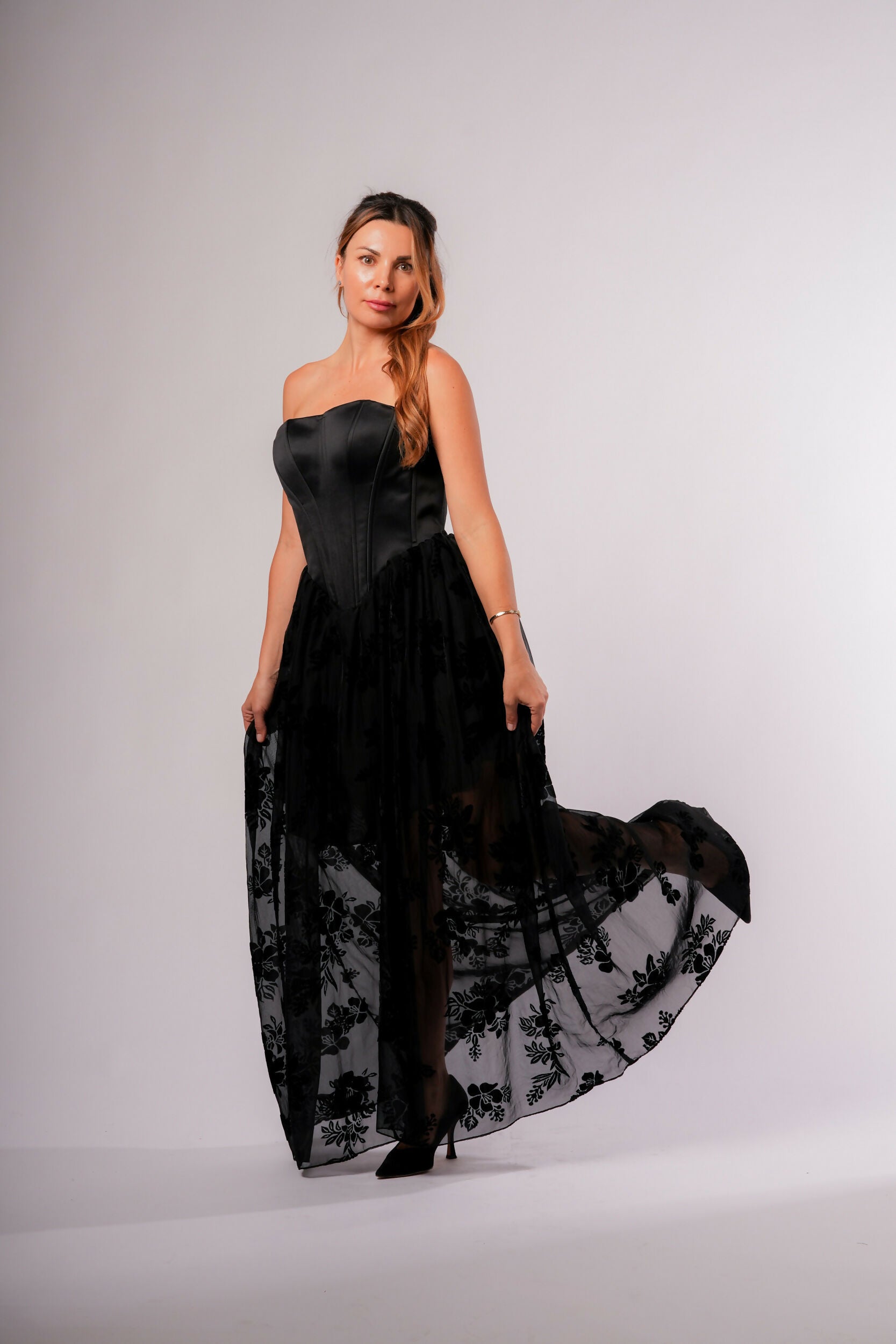 Black Corset Dress. The Bottom Of The Dress With Transparent Flowers